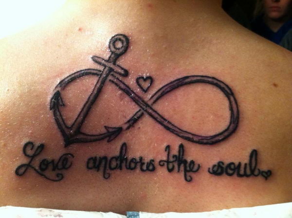 Love Anchors The Soul – Black Ink Anchor With Infinity Tattoo On Upper Back