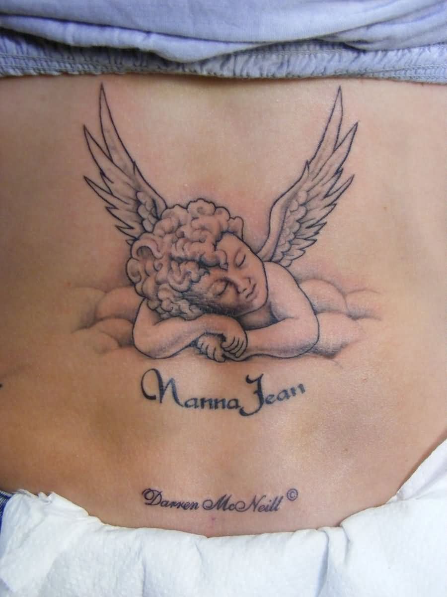 Manna Jean - Black Ink Baby Angel Tattoo On Lower Back