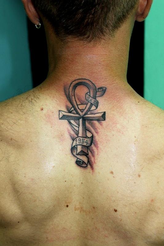 Memorial Black Ink Ankh With Bannner Tattoo On Man Upper Back