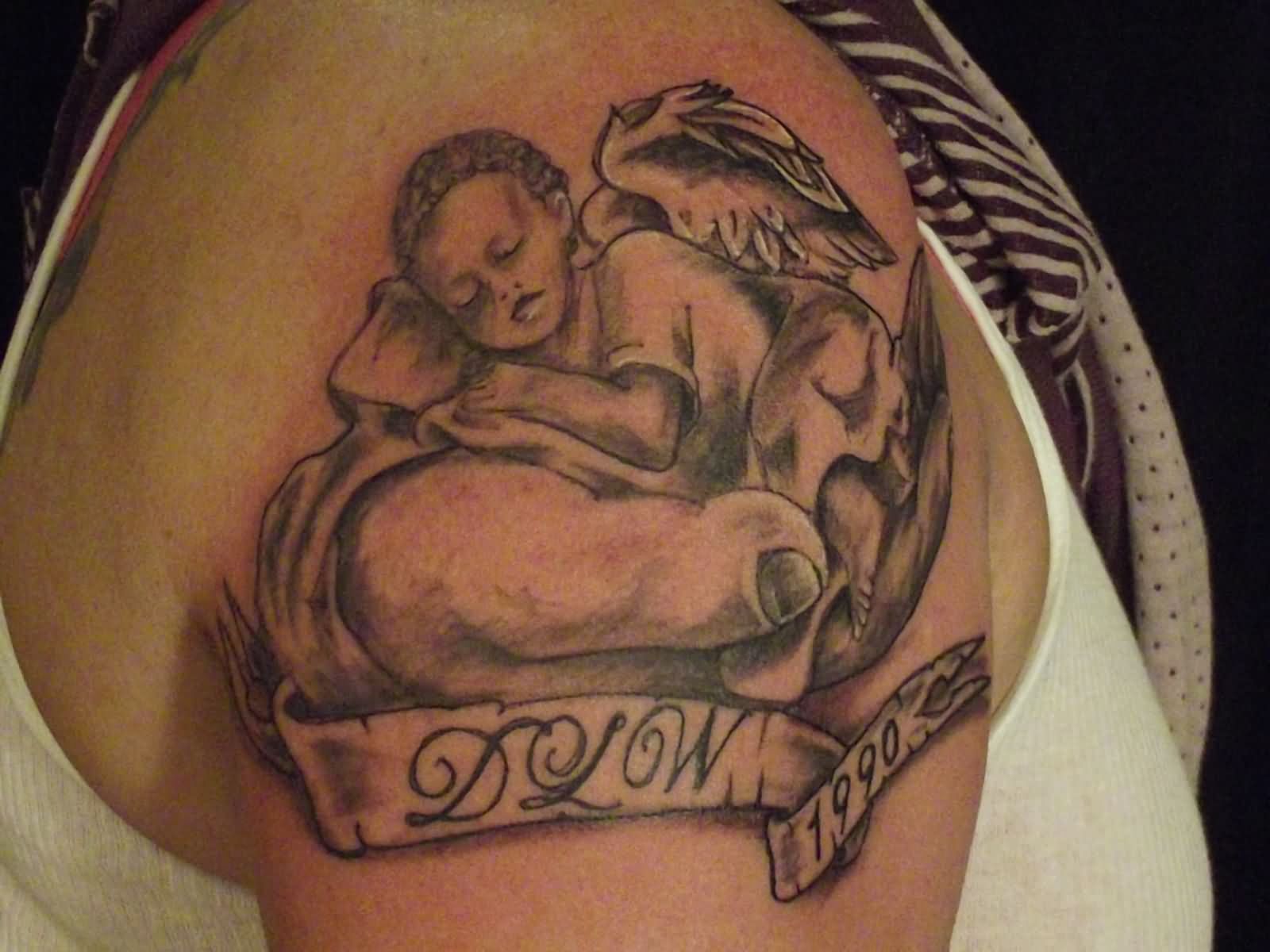 Memorial Black Ink Baby Angel With Banner Tattoo On Right Shoulder