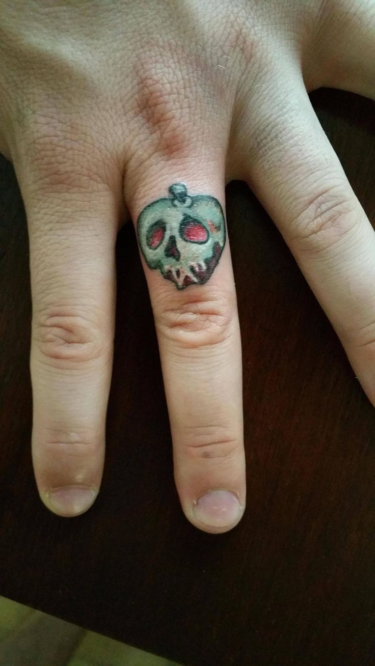 Poison Apple Tattoo On Right Hand Finger