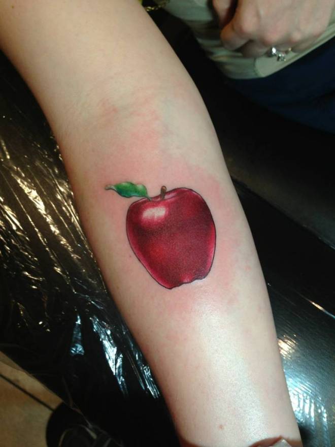 Red Ink Apple Tattoo On Right Forearm