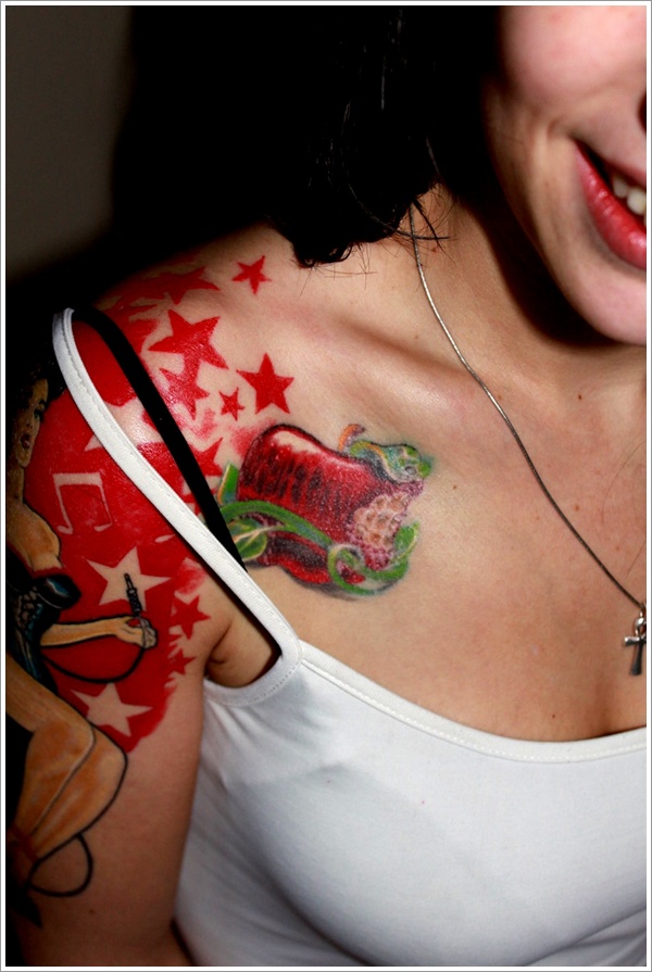 Red Ink Apple Tattoo On Women Right Front Shoulder
