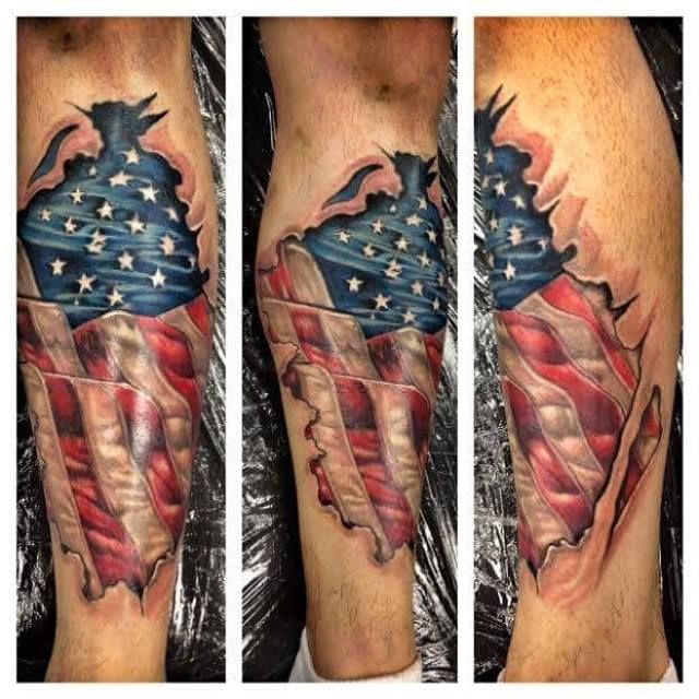Ripped Skin America Flag Tattoo On Leg By Fallen Empire
