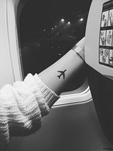 Silhouette Airplane Tattoo On Left Forearm
