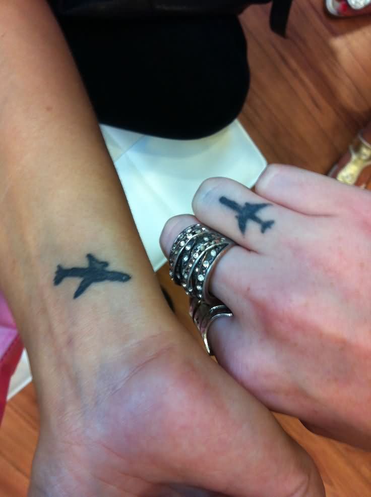 Silhouette Airplane Tattoo On Wrist And Finger