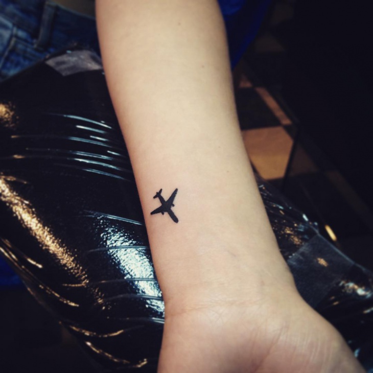Silhouette Airplane Tattoo On Wrist