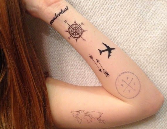 Silhouette Airplane With Compass And Arrows Tattoo On Girl Left Forearm