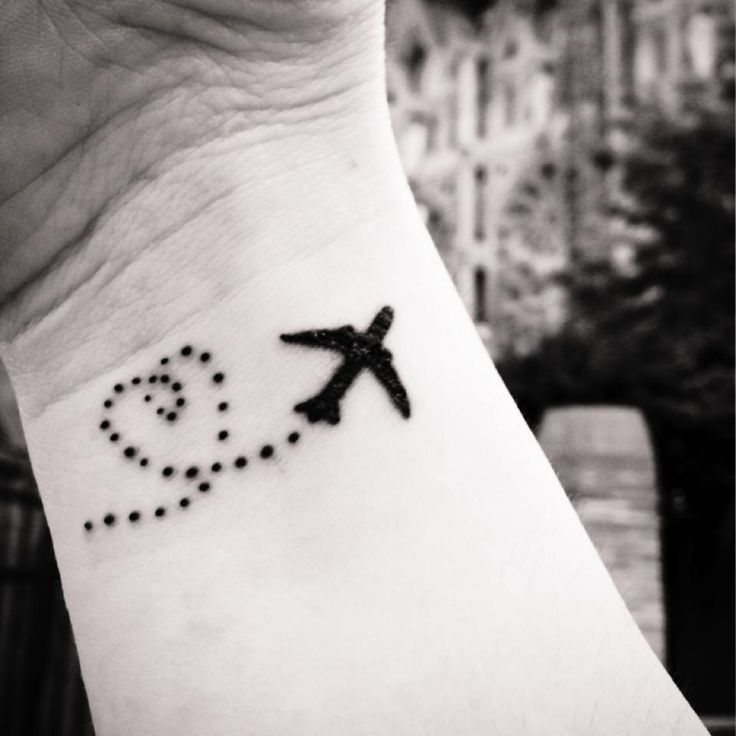 Silhouette Flying Airplane Tattoo On Wrist