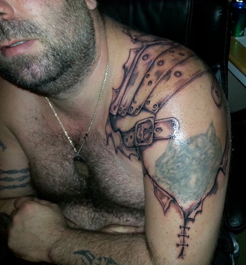 Simple Ripped Skin Armor Tattoo On Man Left Shoulder
