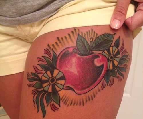 Traditional Apple Tattoo On Left Thigh