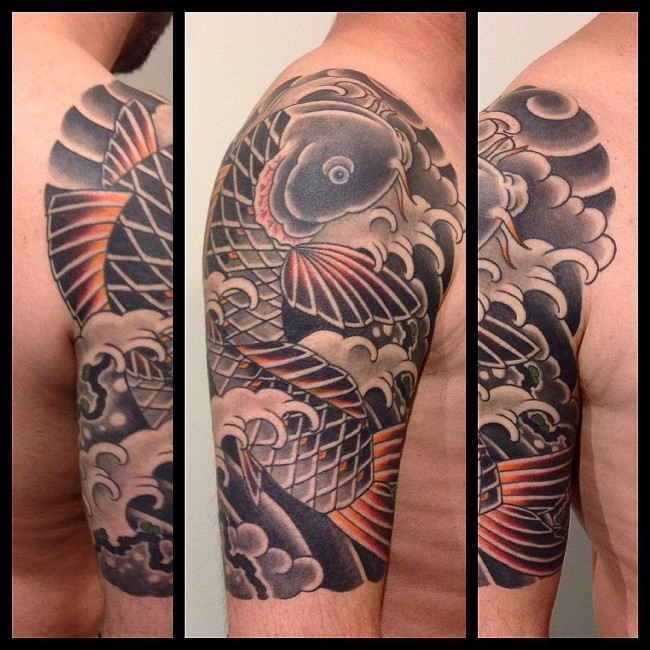 Traditional Black Ink Koi Fish Tattoo On Man Right Half Sleeve