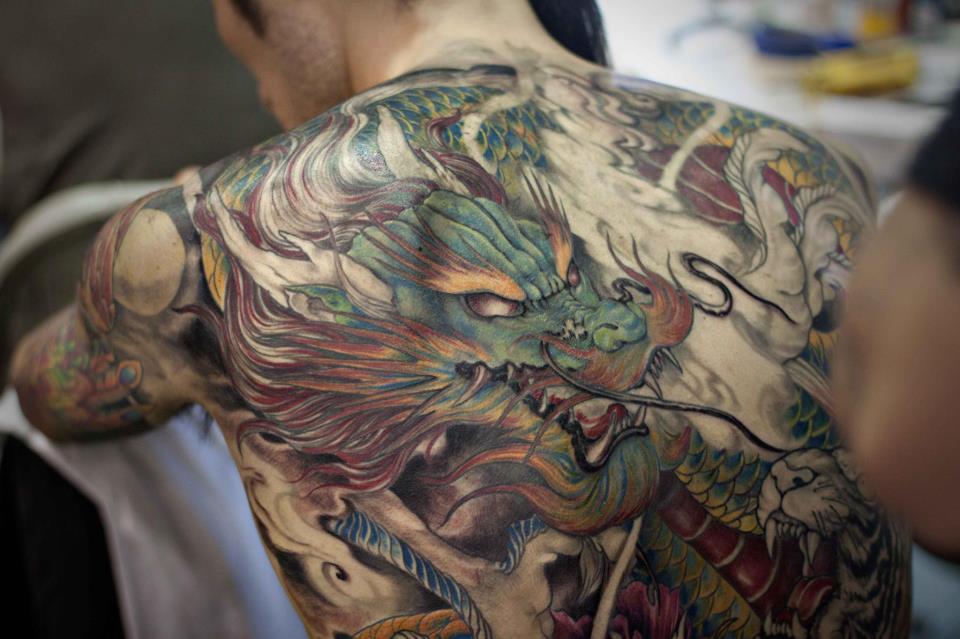 Traditional Dragon Tattoo On Man Upper Back