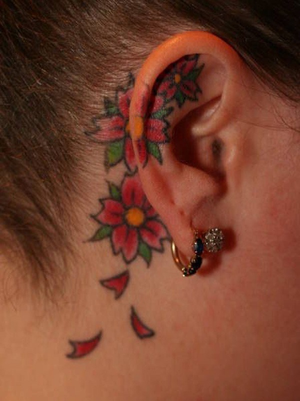 Traditional Flowers Tattoo On Right Ear