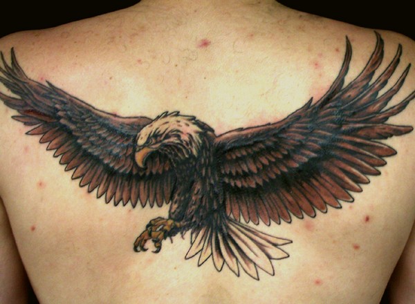 Traditional Flying Eagle Tattoo On Man Upper Back