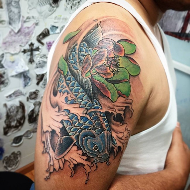 Traditional Koi Fish With Flower Tattoo On Right Half Sleeve