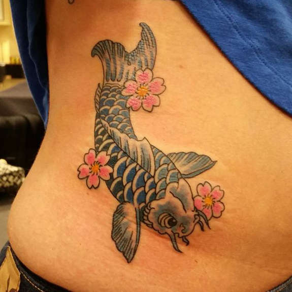 Traditional koi Fish With Flowers Tattoo On Right Side Rib