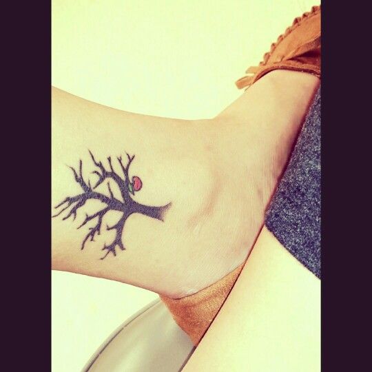 Tree Without Leaves With Apple Tattoo On Right Ankle
