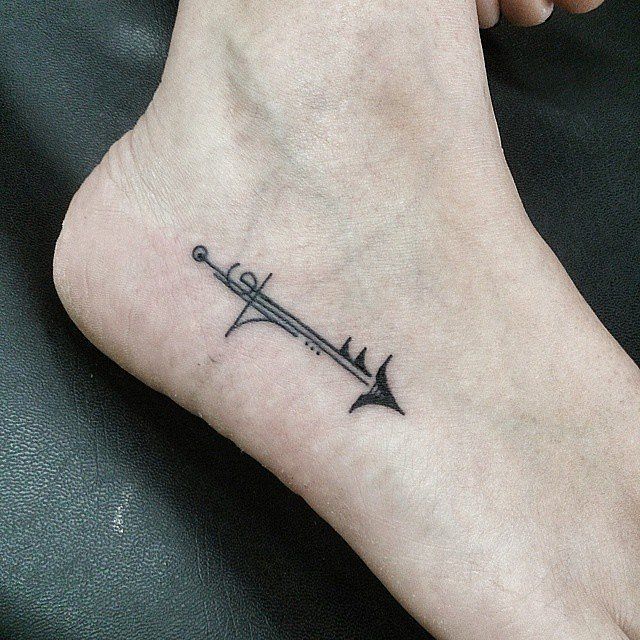 Unique Black Arrow Tattoo On Right Ankle