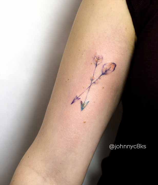 Watercolor Arrow Tattoo On Right Bicep By Johnny Kelly