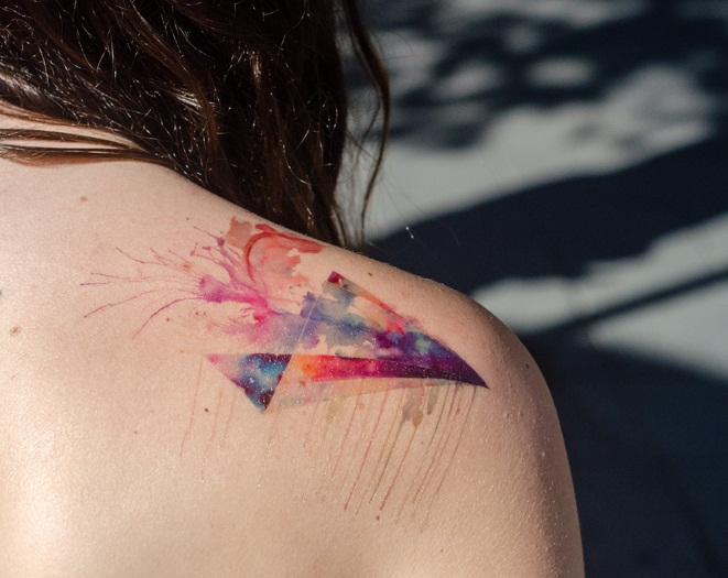 Watercolor Paper Airplane Tattoo On Girl Right Back Shoulder