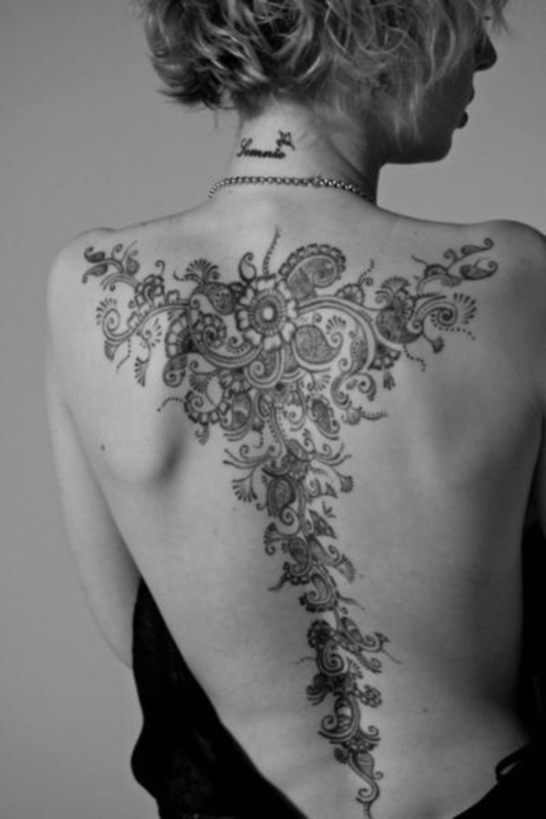 Wonderful Black Ink Flowers Tattoo On Women Full Back