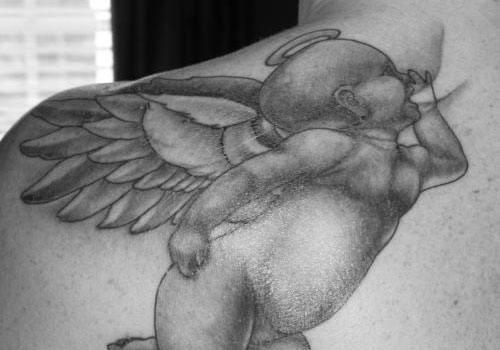 Wonderful Black Ink Flying Baby Angel Tattoo On Left Back Shoulder