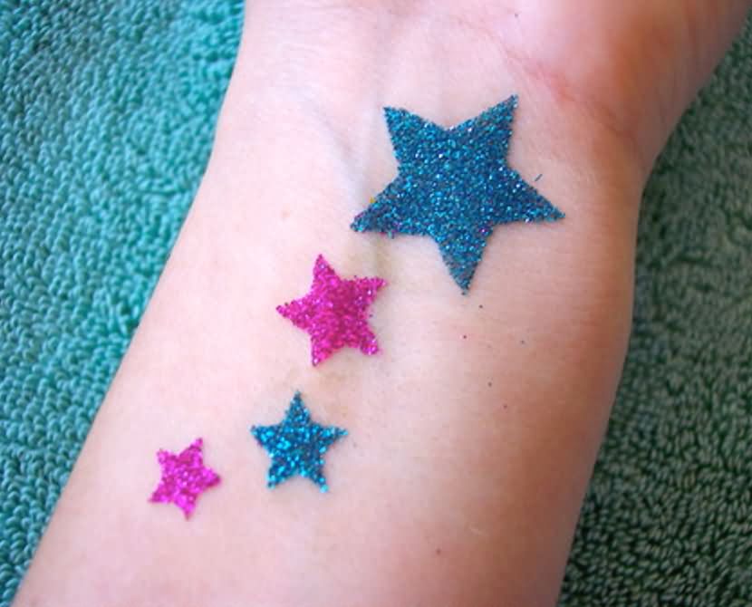Attractive Colorful Glitter Stars Tattoo Design For Wrist