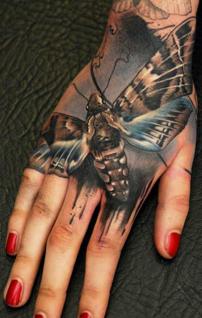 Attractive Moth Tattoo On Girl Right Hand