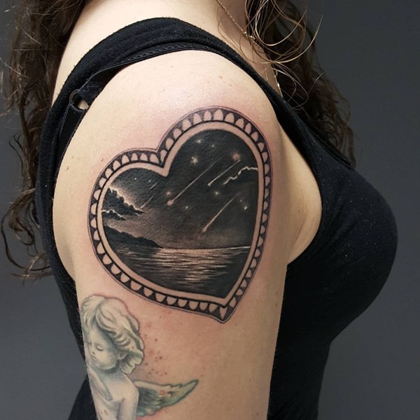 Awesome Black Ink Heart Frame Tattoo On Women Right Shoulder