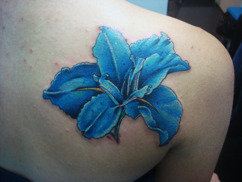 Awesome Blue Ink Iris Flower Tattoo On Right Back Shoulder