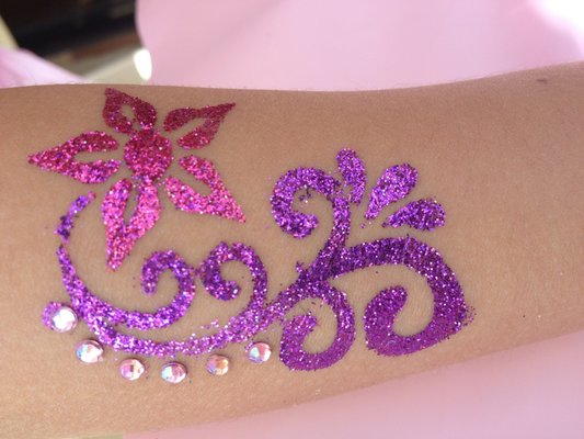 Awesome Glitter Flowers Tattoo On Sleeve