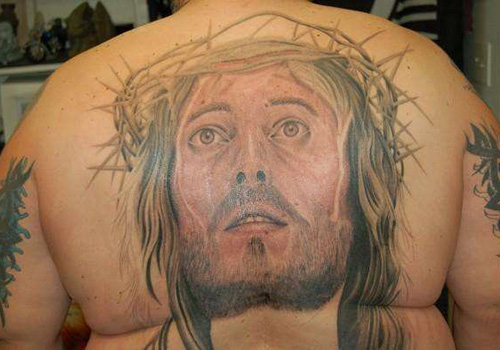 Awesome Jesus Head Tattoo On Man Upper Back