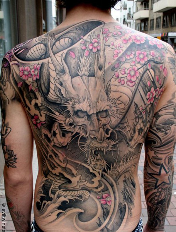 Black And Grey Japanese Dragon Tattoo On Man Full Back