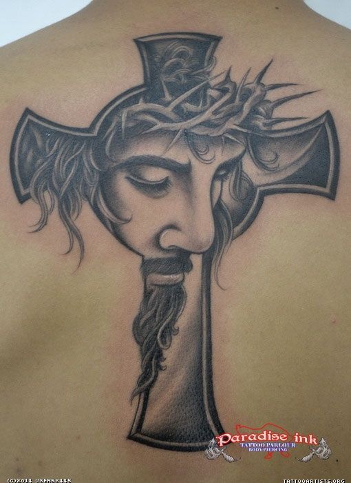Black And Grey Jesus In Cross Tattoo On Man Upper Back
