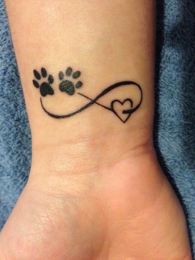 Black Infinity With Paw Prints And Heart Tattoo On Wrist