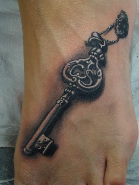 Black Ink 3D Key Tattoo On Left Foot