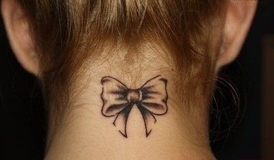 Black Ink Bow Tattoo On Girl Right Back Neck