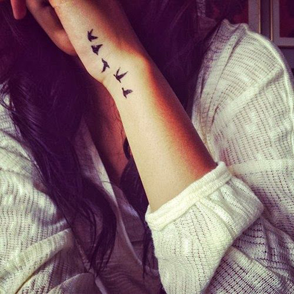 Black Ink Flying Birds Tattoo On Girl Left Side Wrist