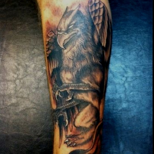 Black Ink Flying Griffin Tattoo On Full Sleeve