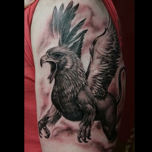Black Ink Flying Griffin Tattoo On Man Left Half Sleeve