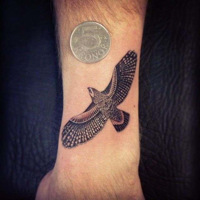 Black Ink Flying Hawk Tattoo Design For Arm