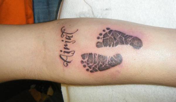 Black Ink FootPrints Tattoo Design For Forearm