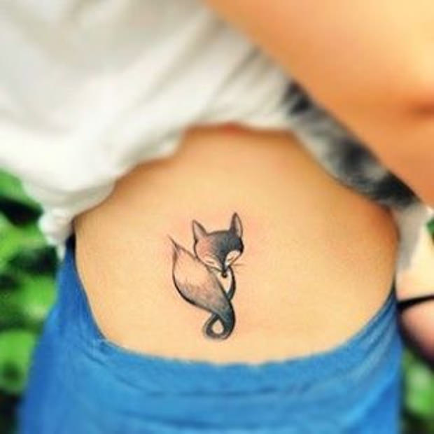 Black Ink Fox Tattoo On Right Side Rib