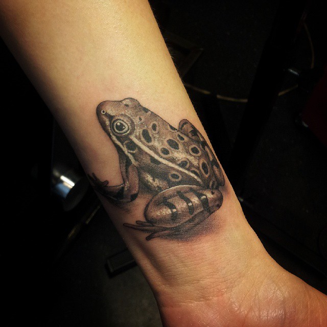 Black Ink Frog Tattoo On Left Wrist