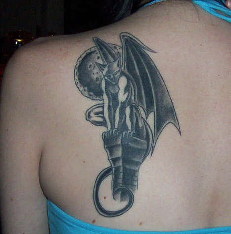 Black Ink Gargoyle Tattoo On Women Left Back Shoulder