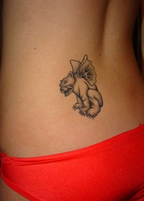 Black Ink Gargoyle Tattoo On Women Lower Back