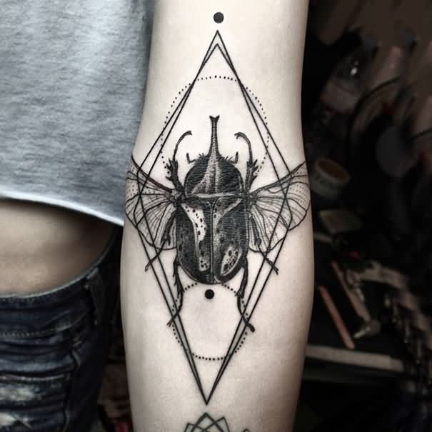 Black Ink Geometric Beetle Tattoo On Left Forearm