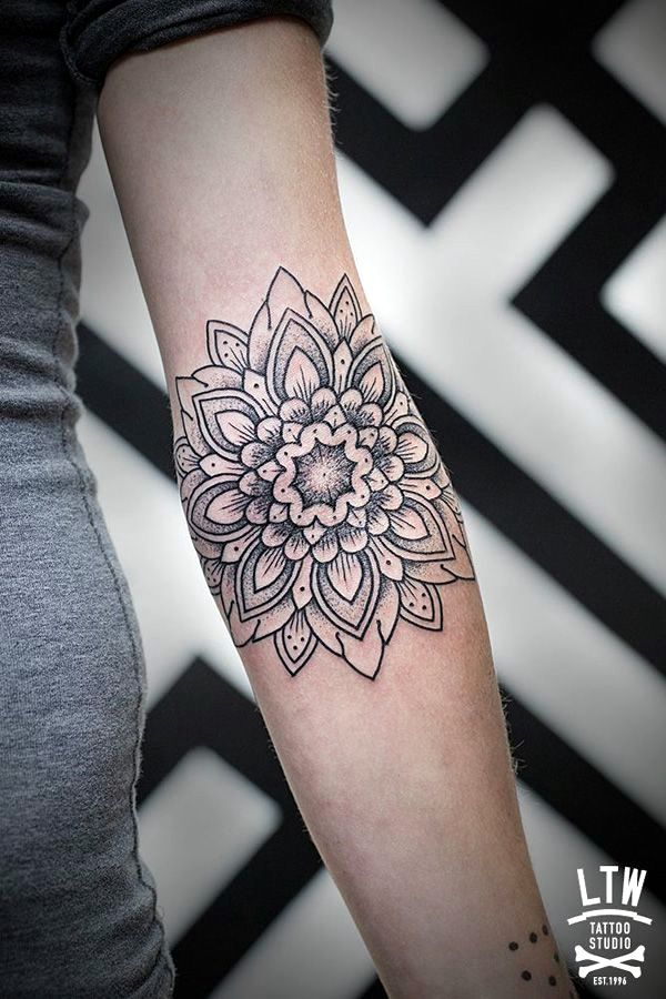 Black Ink Geometric Flowers Tattoo On Left Forearm