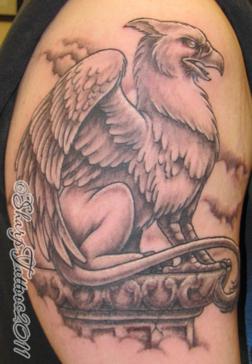 Black Ink Griffin Tattoo On Right Half Sleeve